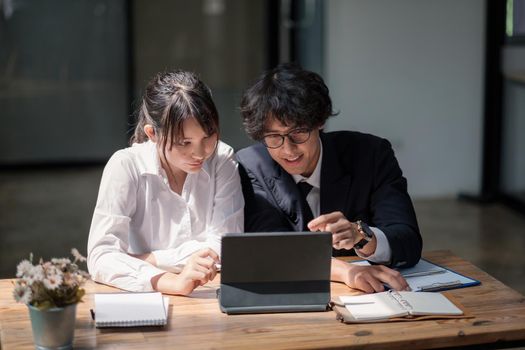 University asian students learning language using digital tablet and internet, working project together. Exam preparation. Online education concept. team of coworkers brainstorming. Meeting. Teamwork