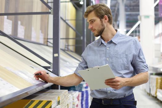 Manager use his tablet for online checking products available