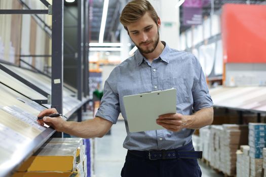 Manager use his tablet for online checking products available