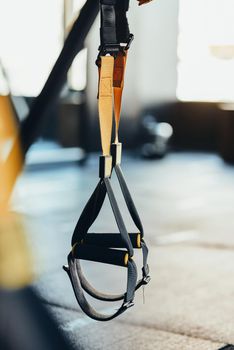Functional training equipment and sport accessories. Close up shot of fitness trx straps. Active lifestyle, fitness and training concept
