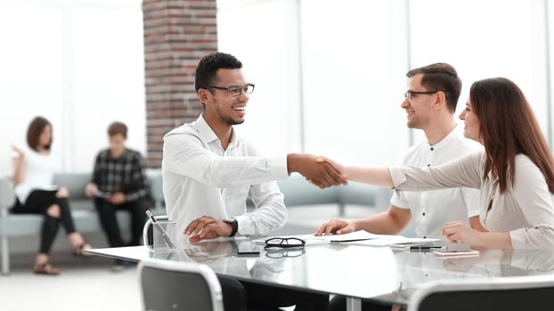 handshake of business people in the lobby of the modern business center. photo with copy space