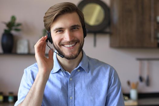 Male customer support operator with headset and smiling