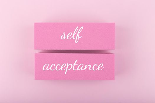 Trendy minimal self acceptance creative concept in monochromatic pink colors. Mental health, self acceptance, self care and respect or body positive. Simple elegant composition