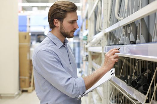 Manager use his tablet for online checking products available