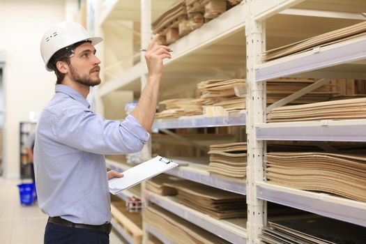 Manager use his tablet for online checking products available