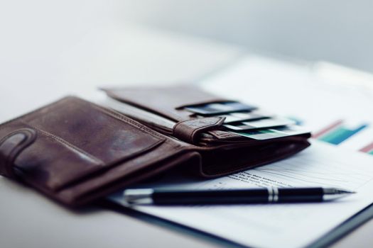 leather wallet with credit cards on the office Desk. business concept