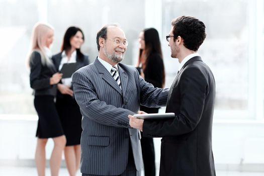 project Manager shaking hands with the employee prior to the seminar .photo with copy space