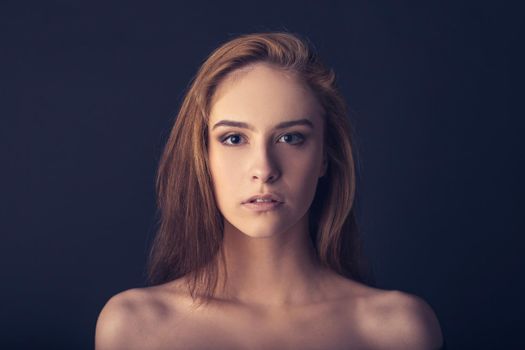 close up. portrait of a young woman with soft makeup. isolated on black background