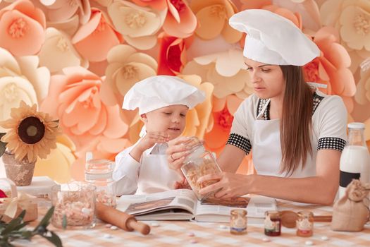 mom and her little son are making Breakfast together. the concept of parenting