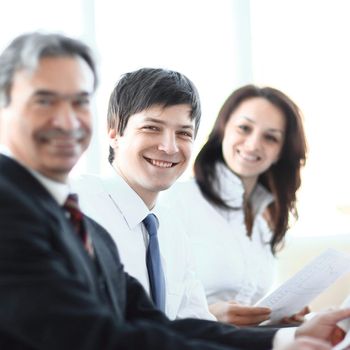 closeup. senior businessman sitting at a meeting . the concept of teamwork