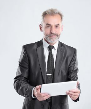 modern businessman with digital tablet.isolated on grey background.