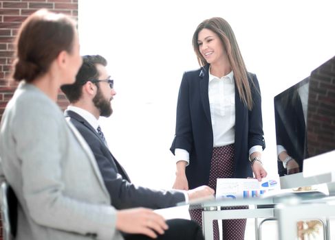 business woman holds a working meeting in the office . business concept