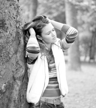 beautiful young woman on background of city Park.