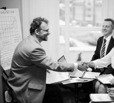 handshake financial partners prior to discussion of the transaction. photo with copy space