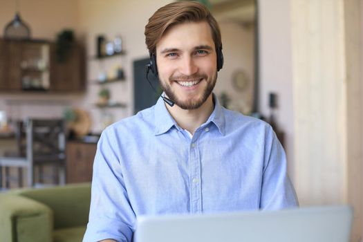 Freelance operator talking with headsets and consulting clients from home office