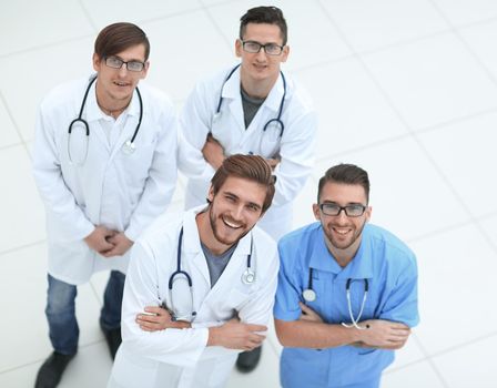 view from the top. the team of doctors looking at the camera.isolated on white