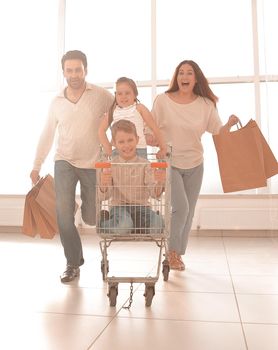 happy family in a hurry to shop.photo with copy space