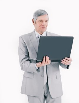 closeup.handsome senior businessman working on laptop.