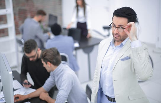 modern businessman standing in office.the concept of success