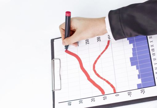 closeup .Businessman drawing a stock chart.isolated on white background