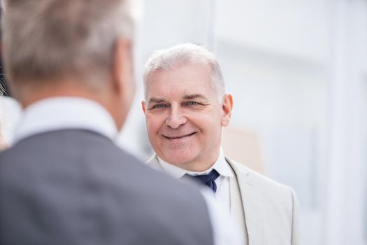 close up. two business men talking in the office. office weekdays