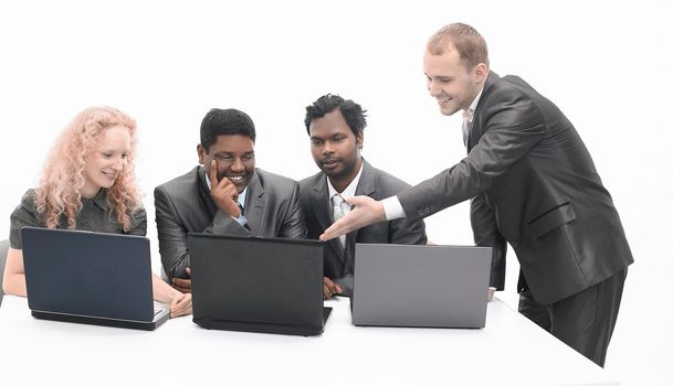 successful business team discussing the information with the laptop .isolated on white