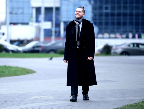 businessman standing on the street of a big city.photo with copy space