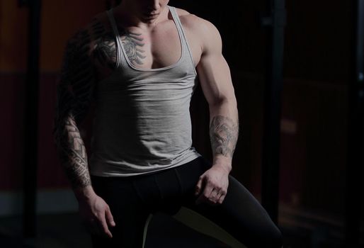 confident man bodybuilder in the gym.photo with copy space.sport and health