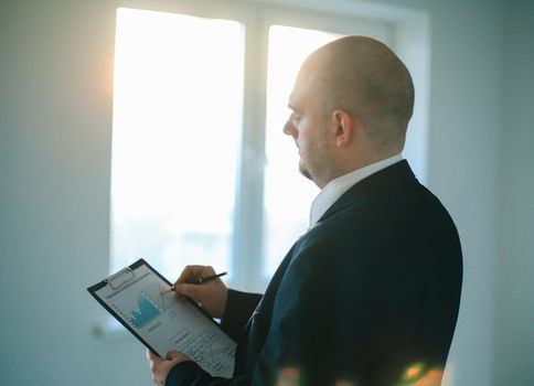 close up.the businessman checks the financial schedule.photo with copy space.