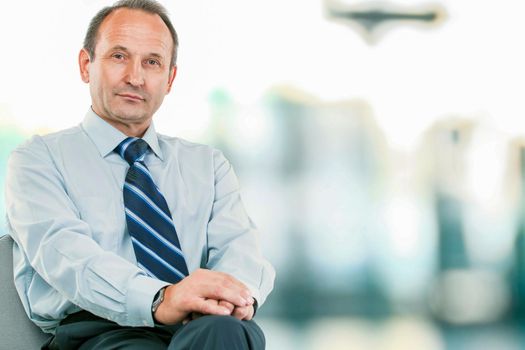portrait - lawyer consultant sitting in my Desk chair on light blurred background photo has an empty space for your text