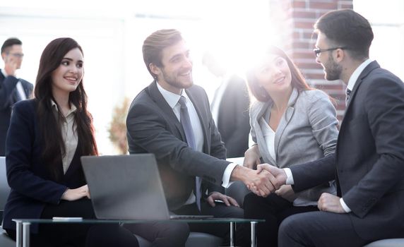 Managers of the company and the client, discussing the terms of the new contract and look at the laptop screen with the correct information.