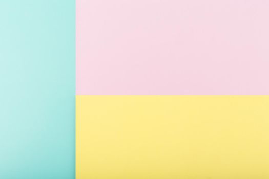 Elegant multicolored background made of bright yellow, purple and aqua blue paper. Concept of template for website, banner, ad with space for text
