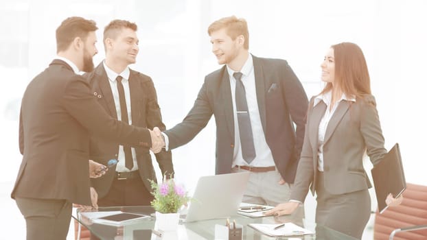 business woman greets the employee with a handshake,photo with copy space