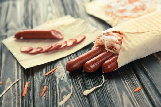 sausages wrapped in pita bread.preparation of Shawarma.photo with copy space.
