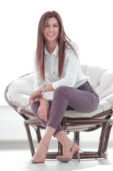 modern young young woman sitting in a comfortable chair. lifestyle