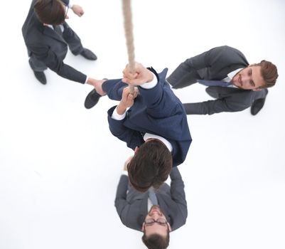 top view .business team helps the leader to climb up.photo with copy space