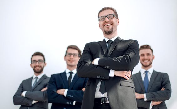 smiling business man standing in front of business team.photo with copy space