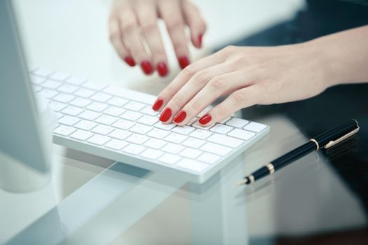 closeup.business woman typing text on the computer keyboard.people and technology