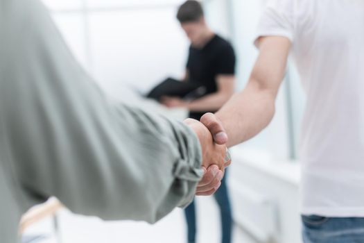 close up. business handshake in an office background .concept of cooperation