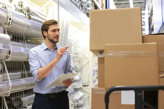 Manager use his tablet for online checking products available