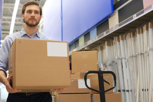 Portrait of a smiling warehouse keeper at work
