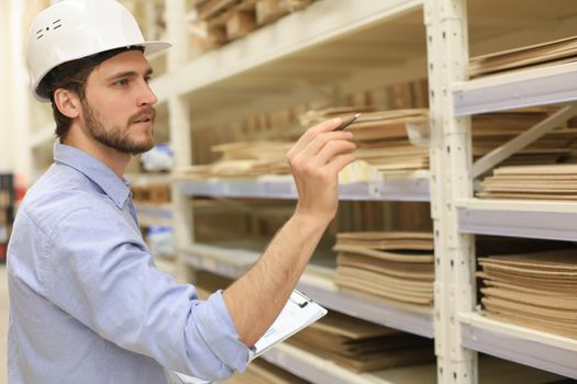 Manager use his tablet for online checking products available