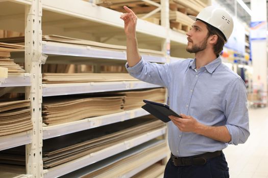 Manager use his tablet for online checking products available