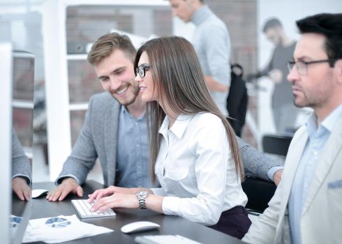 group of business people sitting at the office table. the concept of teamwork