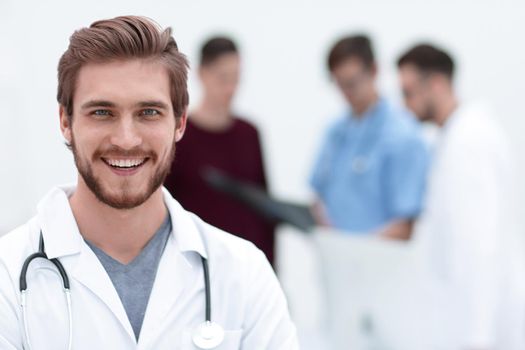 closeup.portrait of a handsome doctor on blurred background office