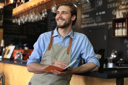 Small business owner working at his cafe