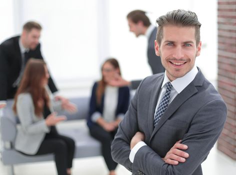 close-up of a successful businessman, against colleagues