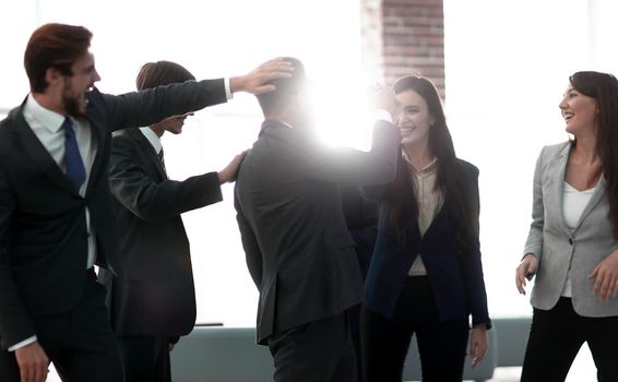 The handsome businessman gets so happiness because he can earn a lot of money from his business.