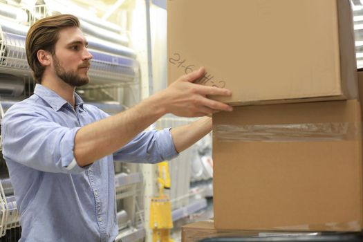 Portrait of a smiling warehouse keeper at work