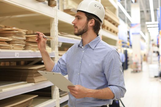 Manager use his tablet for online checking products available